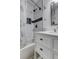 Bathroom features a shower-tub combination and modern white vanity at 211 S Obrien St, Tampa, FL 33609
