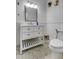 Bathroom features a patterned tile floor and large white vanity at 211 S Obrien St, Tampa, FL 33609