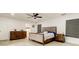 Bedroom features wood-look flooring and large dresser at 211 S Obrien St, Tampa, FL 33609