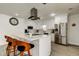 Bright kitchen with stainless steel appliances, island seating, and modern fixtures at 211 S Obrien St, Tampa, FL 33609