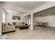 Spacious living room area featuring tile floors, neutral walls, and dining area at 211 S Obrien St, Tampa, FL 33609