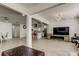 Open-concept living room showcasing modern lighting, tile floors, and an adjacent kitchen at 211 S Obrien St, Tampa, FL 33609