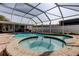 Backyard covered swimming pool, with a spa, and a screened enclosure at 211 S Obrien St, Tampa, FL 33609