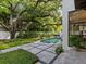 Stunning backyard showcasing the pool, lush greenery, and patio, ideal for outdoor relaxation at 2603 W Parkland Blvd, Tampa, FL 33609
