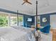 Spacious main bedroom with sitting area, lots of natural light, and a ceiling fan at 2603 W Parkland Blvd, Tampa, FL 33609