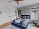 Bedroom with bold wallpaper, plush rug, and a large window offering great natural light at 2603 W Parkland Blvd, Tampa, FL 33609