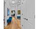 Long hallway features hardwood floors, recessed lighting, and mirrored door at 2603 W Parkland Blvd, Tampa, FL 33609
