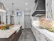 Modern kitchen with stainless steel appliances, a large sink, and ample counter space with marble countertops at 2603 W Parkland Blvd, Tampa, FL 33609