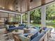 Relaxing screened porch with comfortable sofas overlooking the backyard and pool at 2603 W Parkland Blvd, Tampa, FL 33609