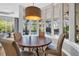 Dining area with a round table and leather chairs, with a view of the pool at 2607 Hawks Landing Blvd, Palm Harbor, FL 34685