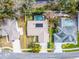 Aerial view of the property showcasing its layout, pool, and surrounding neighborhood at 2893 Turtle Ter, Palm Harbor, FL 34683