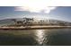 Scenic aerial view of a coastal road lined with palm trees and beach at 2893 Turtle Ter, Palm Harbor, FL 34683