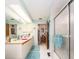 Bathroom featuring double sinks, a shower, and a bright skylight at 2893 Turtle Ter, Palm Harbor, FL 34683