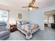 Comfortable bedroom featuring a ceiling fan, soft blue walls, and tranquil ambiance at 2893 Turtle Ter, Palm Harbor, FL 34683