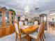 Elegant dining room showcasing a chandelier, china cabinets, and easy access to other rooms at 2893 Turtle Ter, Palm Harbor, FL 34683