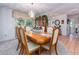 Bright dining room featuring natural light from a window and access to other parts of the house at 2893 Turtle Ter, Palm Harbor, FL 34683