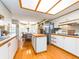 Well-lit kitchen with ample counter space, a center island, and wood floors for a functional cooking area at 2893 Turtle Ter, Palm Harbor, FL 34683