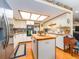 Bright kitchen featuring white cabinetry, a central island, stainless steel appliances, and hardwood floors for a modern feel at 2893 Turtle Ter, Palm Harbor, FL 34683