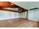 Open basement area with wood floors and a unique wood-paneled ceiling and staircase to loft at 2901 Pelham Rd N, St Petersburg, FL 33710