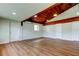 Basement area featuring wood flooring and a unique wood-paneled ceiling with recessed lighting at 2901 Pelham Rd N, St Petersburg, FL 33710