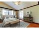 Cozy bedroom featuring neutral walls, light-colored furniture, and a decorative rug at 2901 Pelham Rd N, St Petersburg, FL 33710