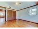 Spacious empty bedroom with hardwood floors, a closet, and natural light at 2901 Pelham Rd N, St Petersburg, FL 33710