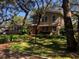 Charming two-story home with mature landscaping and large windows at 2901 Pelham Rd N, St Petersburg, FL 33710