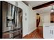 Modern kitchen showcases stainless steel refrigerator and white cabinets at 2901 Pelham Rd N, St Petersburg, FL 33710