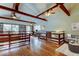 Cozy living room with hardwood floors, exposed beams and a library at 2901 Pelham Rd N, St Petersburg, FL 33710