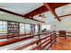 Large living room with hardwood floors, a library, exposed beams and natural light at 2901 Pelham Rd N, St Petersburg, FL 33710