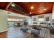 Relaxing living room with a game table, comfortable seating, and wood-paneled ceiling with loft at 2901 Pelham Rd N, St Petersburg, FL 33710