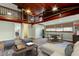 Finished basement with a loft area, game table, and comfortable seating arrangement on stylish rug at 2901 Pelham Rd N, St Petersburg, FL 33710