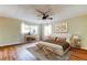 Cozy main bedroom featuring a comfortable bed, decorative furnishings, and natural light from windows at 2901 Pelham Rd N, St Petersburg, FL 33710