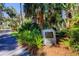 Landmark stone sign at Abercrombie Park surrounded by lush foliage and a paved walkway at 2901 Pelham Rd N, St Petersburg, FL 33710