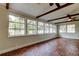 Bright sunroom with brick floors, large windows, and views of the surrounding landscape at 2901 Pelham Rd N, St Petersburg, FL 33710