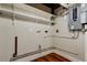 Functional utility room with shelving, plumbing, and a circuit breaker panel at 2901 Pelham Rd N, St Petersburg, FL 33710