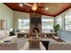 Bright living room with a brick fireplace, wood-paneled ceiling, and two built-in bench seats at 2901 Pelham Rd N, St Petersburg, FL 33710