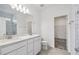 Modern bathroom with double vanity, sleek fixtures, and a glass-enclosed shower, offering a spa-like experience at 3980 Big Sky Dr, Spring Hill, FL 34604