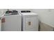 Convenient laundry room featuring a modern washer and dryer set with easy to use controls at 3980 Big Sky Dr, Spring Hill, FL 34604