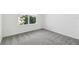 Bright, carpeted bedroom with a large window and ample natural light at 4227 Big Sky Dr, Spring Hill, FL 34604