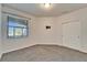 This bedroom features neutral carpet, closet, and a bright window at 438 Seneca Falls Dr, Apollo Beach, FL 33572