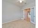 Spacious bedroom featuring neutral walls, a ceiling fan, and double doors leading to another room at 438 Seneca Falls Dr, Apollo Beach, FL 33572