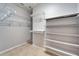 Walk-in closet features custom shelving to maximize storage space at 438 Seneca Falls Dr, Apollo Beach, FL 33572