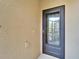 Close up of the front door leading to the porch at 438 Seneca Falls Dr, Apollo Beach, FL 33572