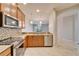 Updated kitchen with granite countertops, stainless steel appliances, and an open layout at 438 Seneca Falls Dr, Apollo Beach, FL 33572