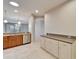 Bright kitchen showcases white cabinets, stainless steel dishwasher, and granite countertops at 438 Seneca Falls Dr, Apollo Beach, FL 33572