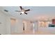 Open-concept living area with tile floors, neutral paint, and ample space for entertaining guests at 438 Seneca Falls Dr, Apollo Beach, FL 33572