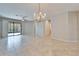 Open floor plan features tile floors, neutral paint, and sliding doors to the outdoor area at 438 Seneca Falls Dr, Apollo Beach, FL 33572