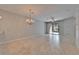 Bright and airy living room with tile floors, neutral paint, and sliding glass door to the outdoors at 438 Seneca Falls Dr, Apollo Beach, FL 33572