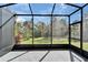 Enjoy the outdoors in this screened patio with tile flooring and beautiful backyard views at 438 Seneca Falls Dr, Apollo Beach, FL 33572
